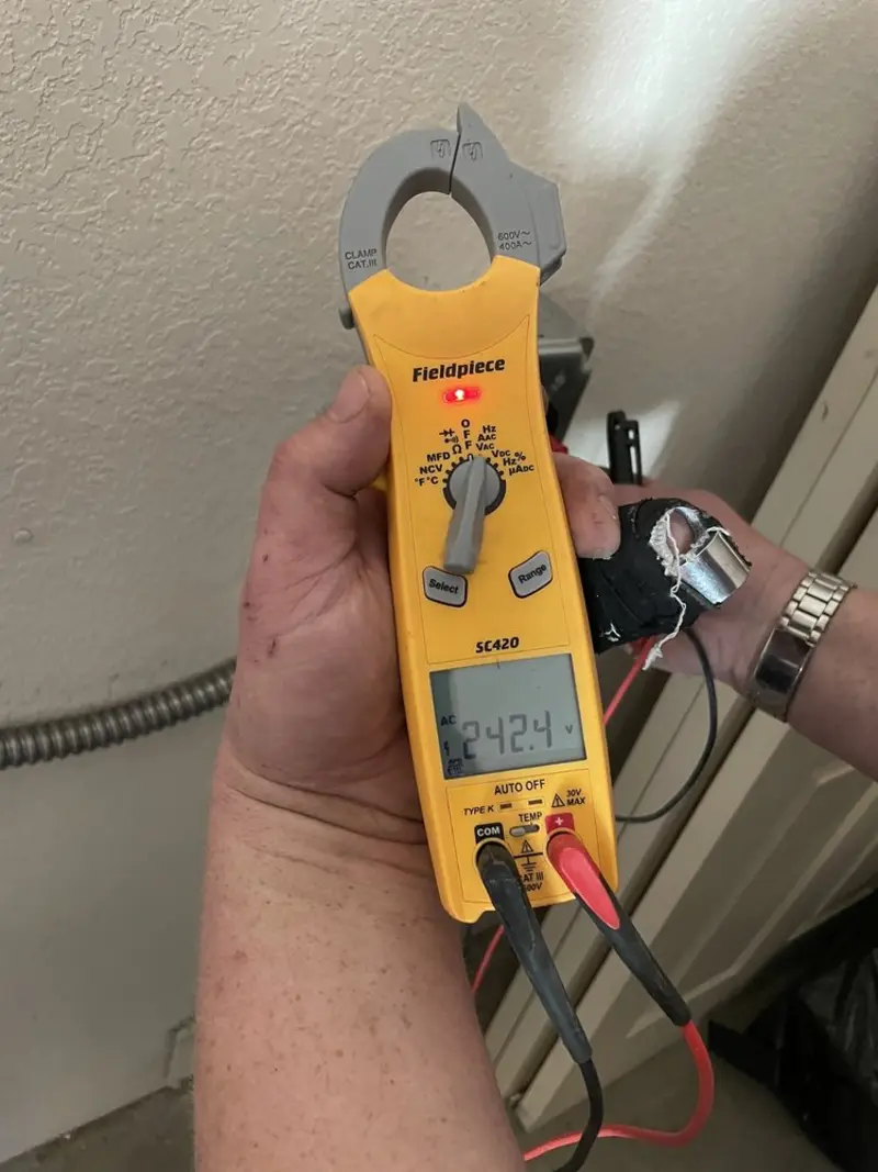 Voltage testing with clamp meter during Outlet Installation in South Harrison